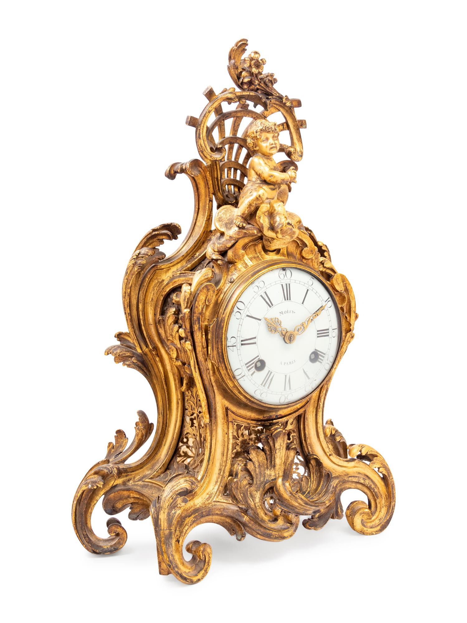 A Louis XV Gilt Bronze Clock and Stand