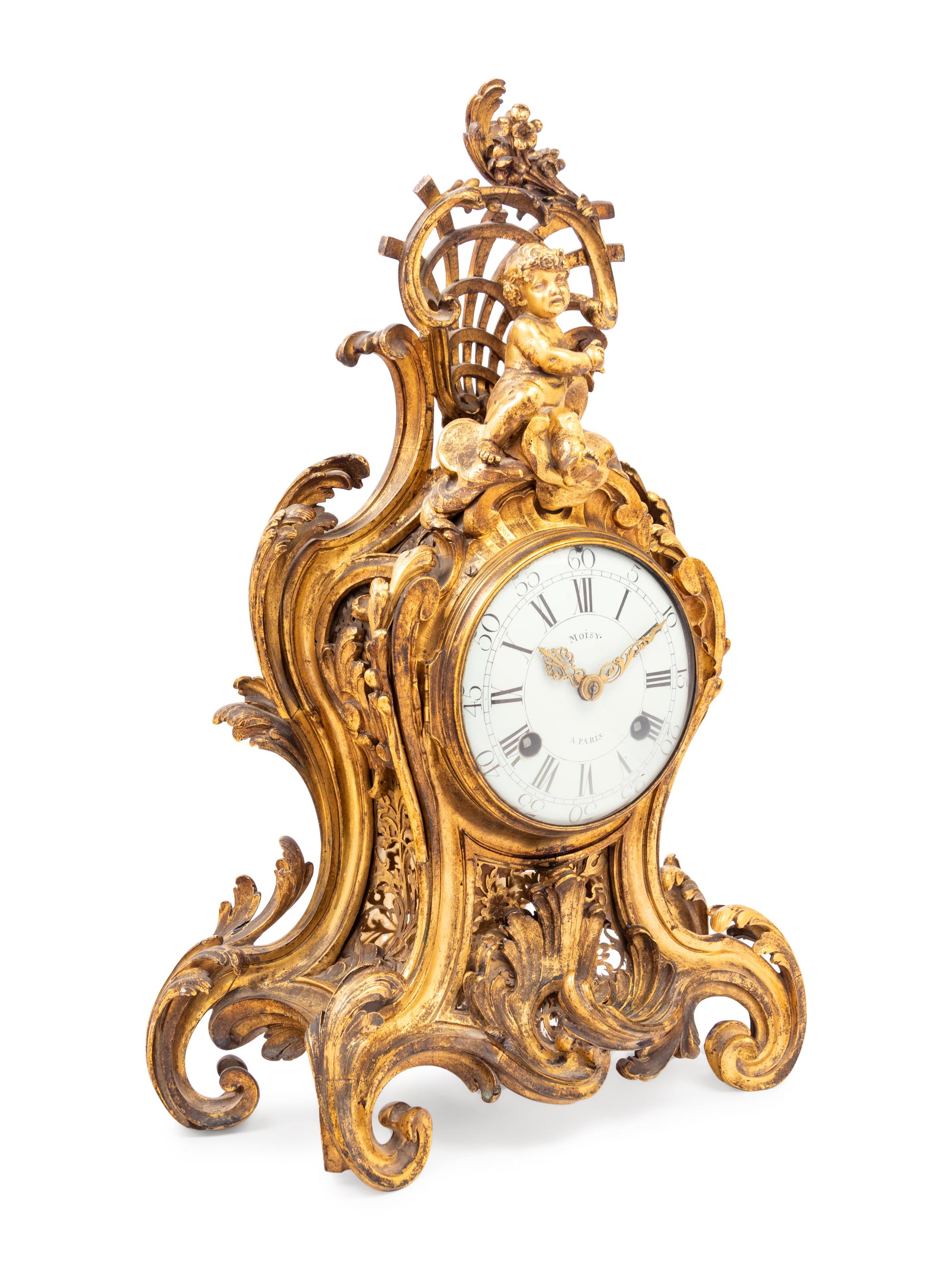 A Louis XV Gilt Bronze Clock and Stand