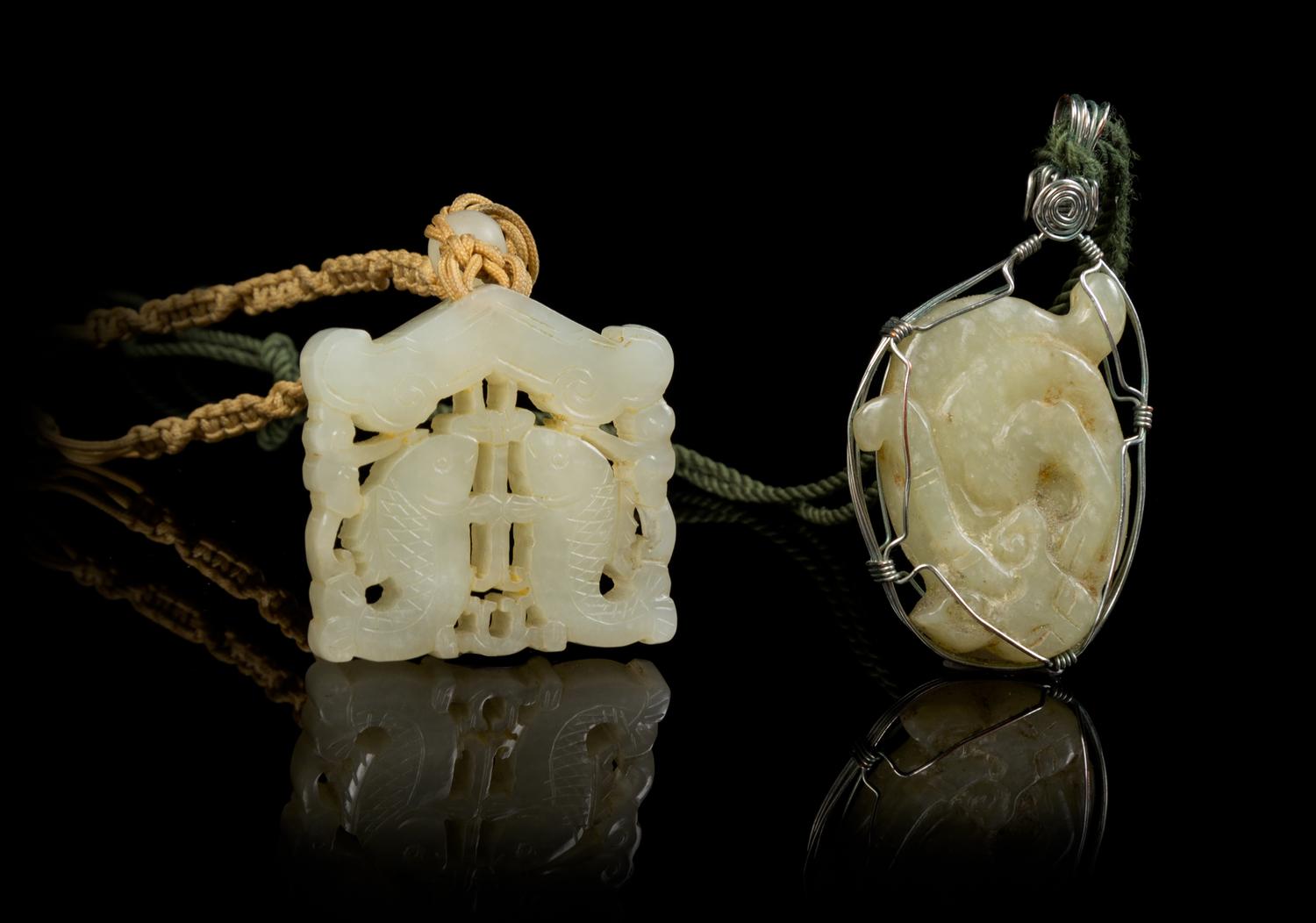 Two Carved Jade Pendants Length of first 1 7/8 inches.
