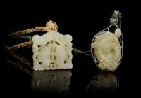 Two Carved Jade Pendants Length of first 1 7/8 inches.