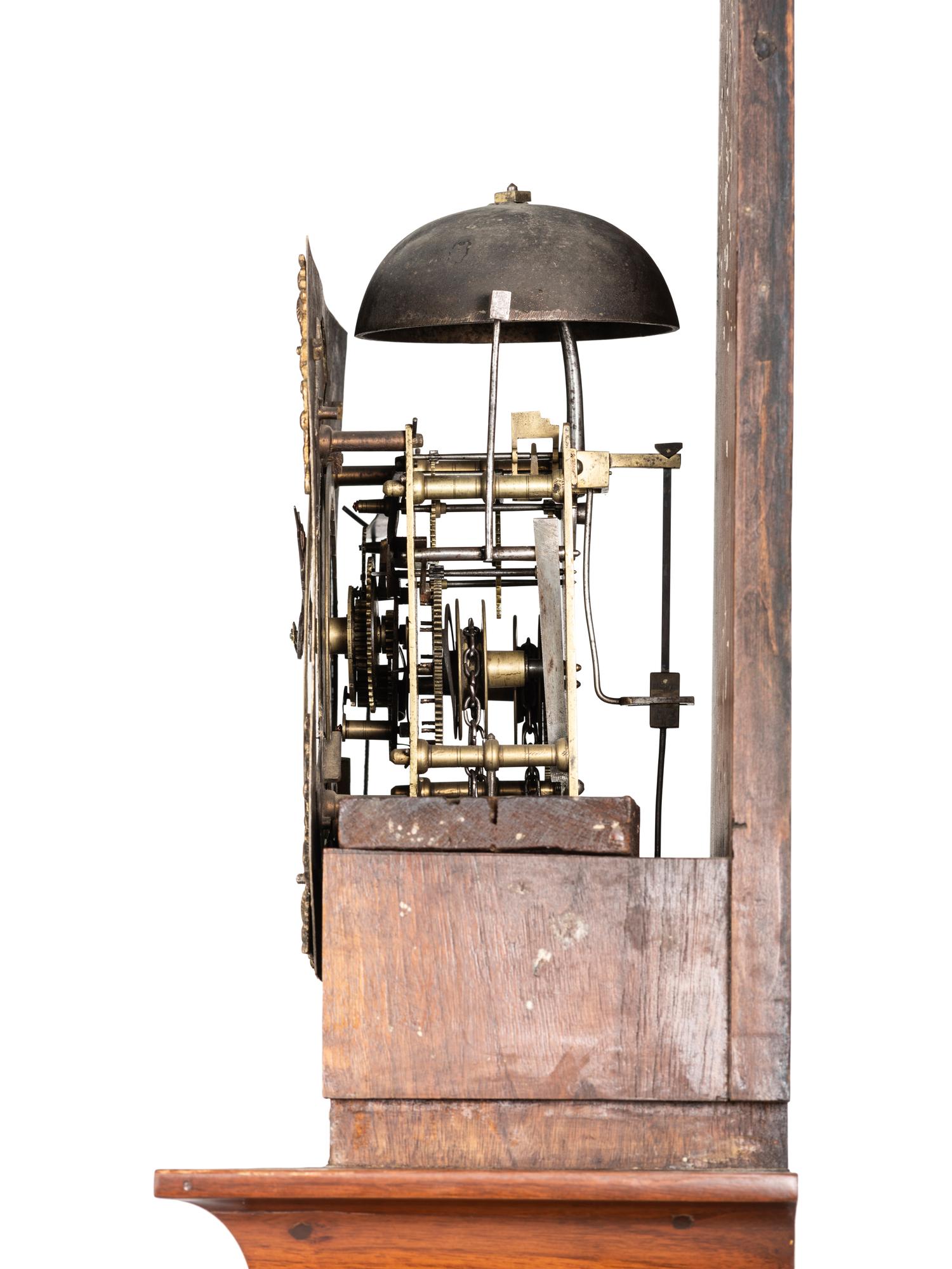 A Queen Anne Walnut Tall Case Clock