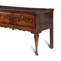 A Queen Anne Oak Four-Drawer Dresser