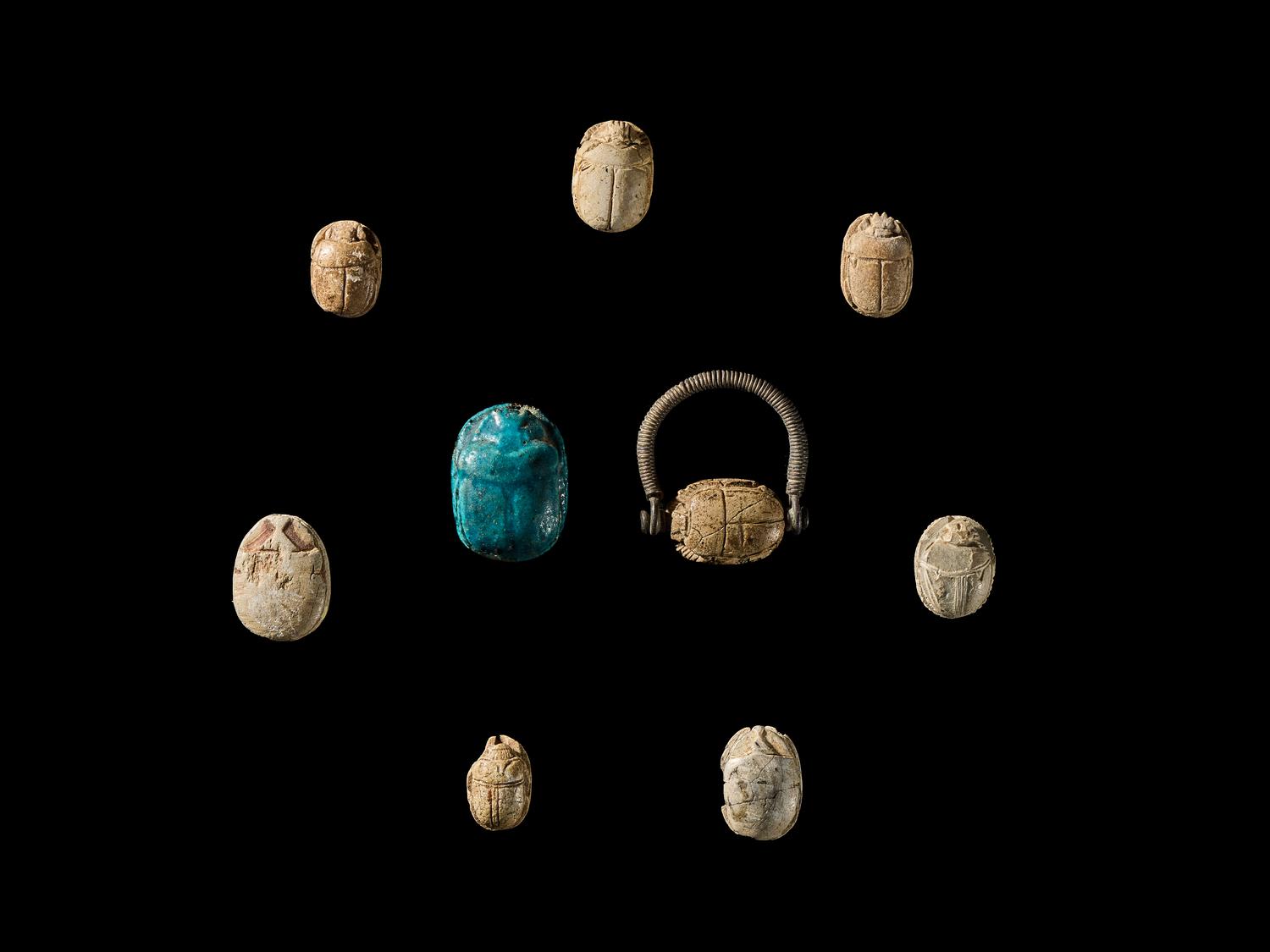 Nine Egyptian Faience and Steatite Scarabs with Royal Inscriptions