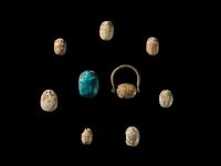 Nine Egyptian Faience and Steatite Scarabs with Royal Inscriptions