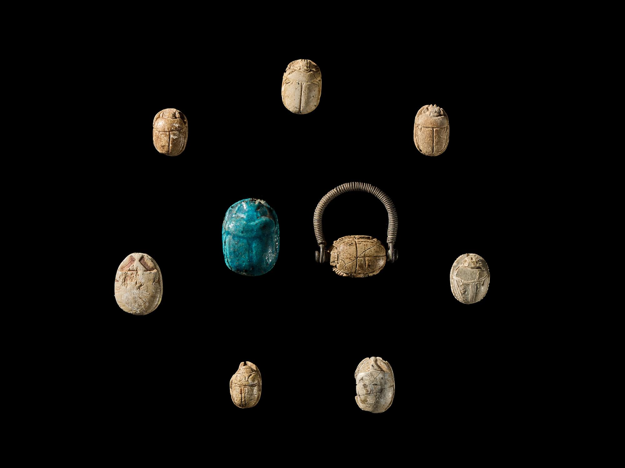Nine Egyptian Faience and Steatite Scarabs with Royal Inscriptions