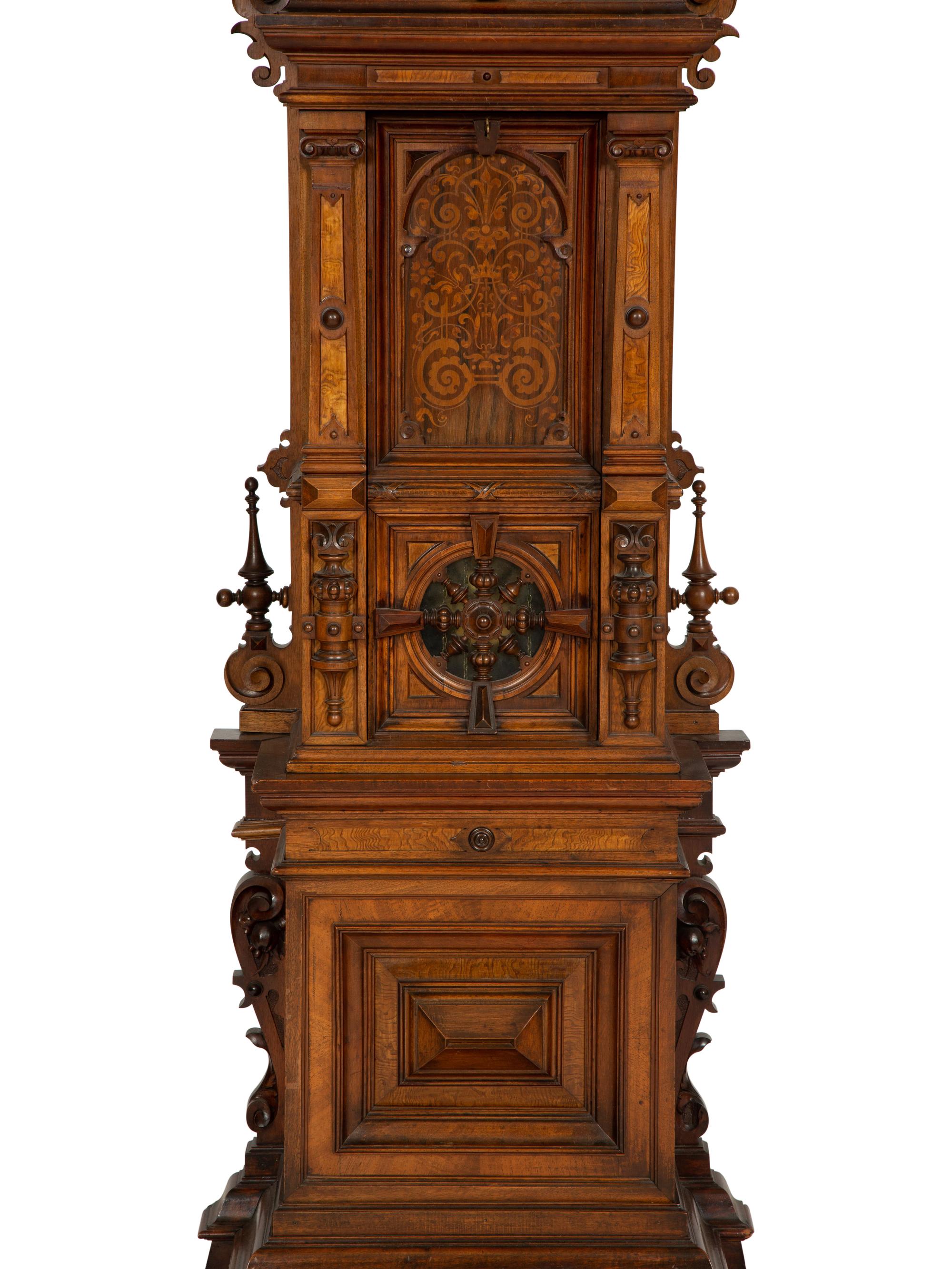 A German Carved Walnut and Marquetry Tall Case Clock