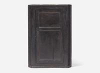 A Chippendale black-painted pine hanging corner cupboard, late 18th century