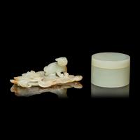 Two Chinese Pale Celadon Jade Scholar's Objects, 19th/early 20th Century 晚清/民國 青白玉荷葉臥貓筆舔及素面蓋盒