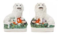 Two Staffordshire Lion Figures Height 9 1/2 inches.