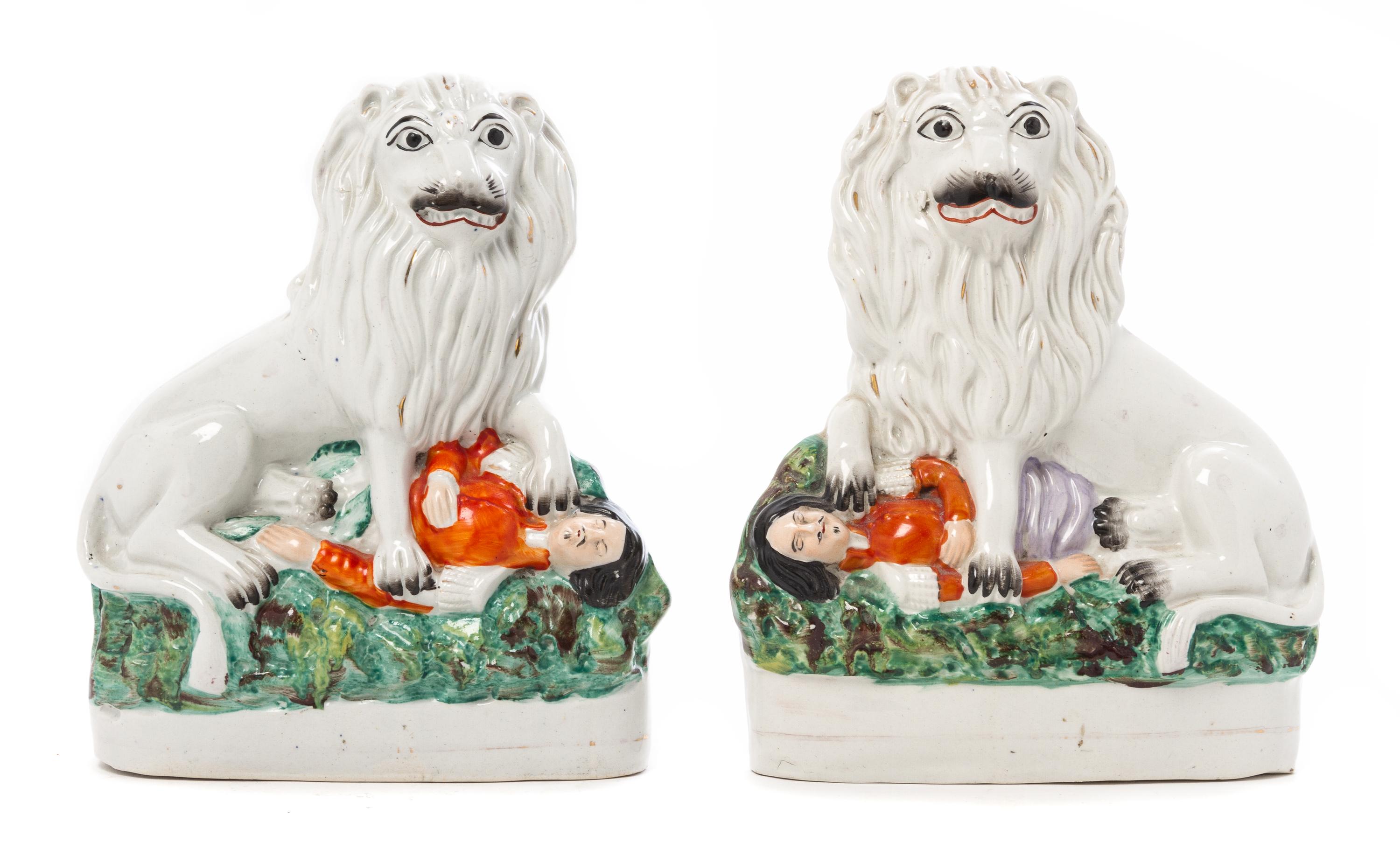 Two Staffordshire Lion Figures Height 9 1/2 inches.