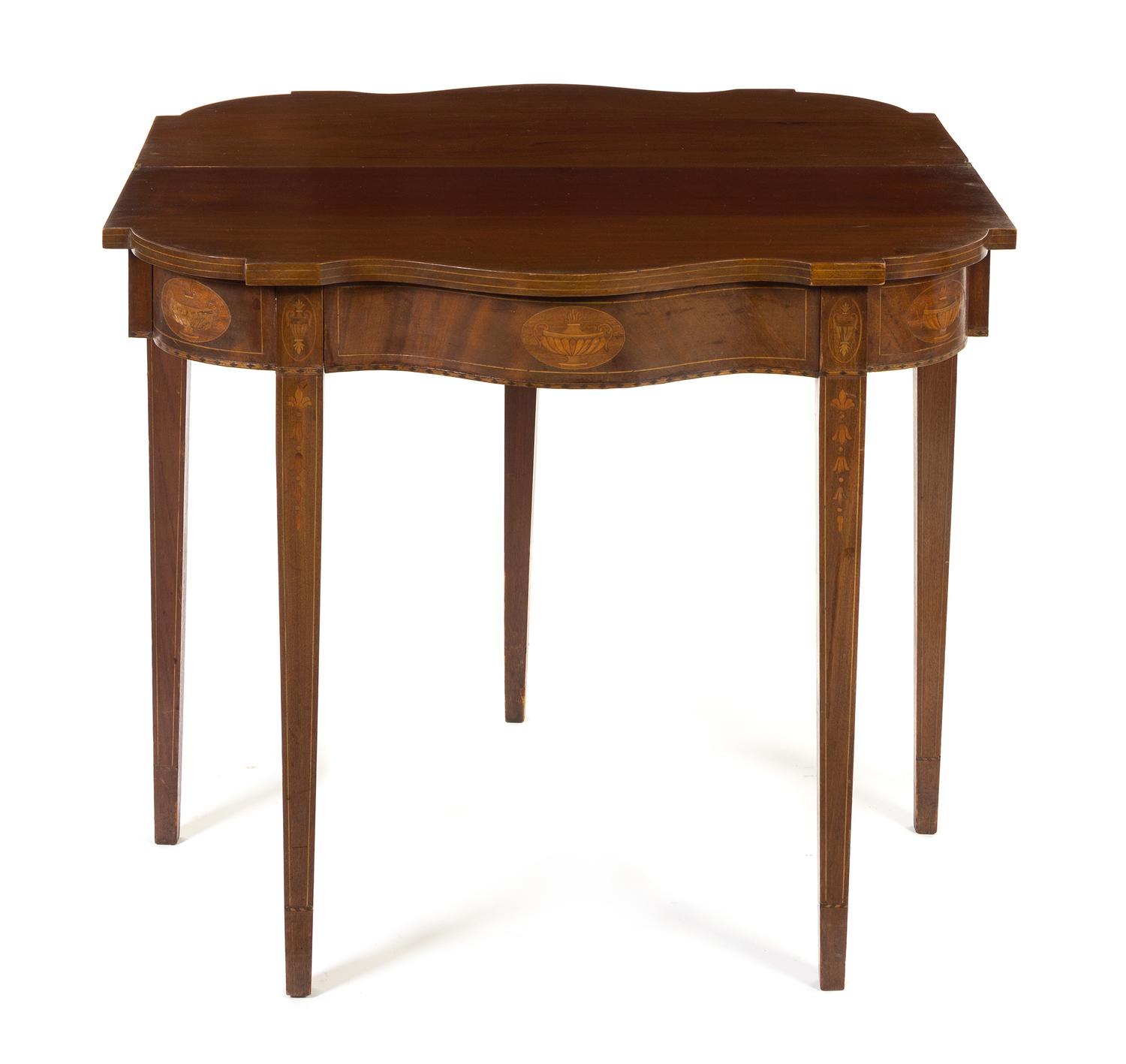 A Hepplewhite Style Marquetry Mahogany Flip-Top Games Table Height 30 x width 34 inches.