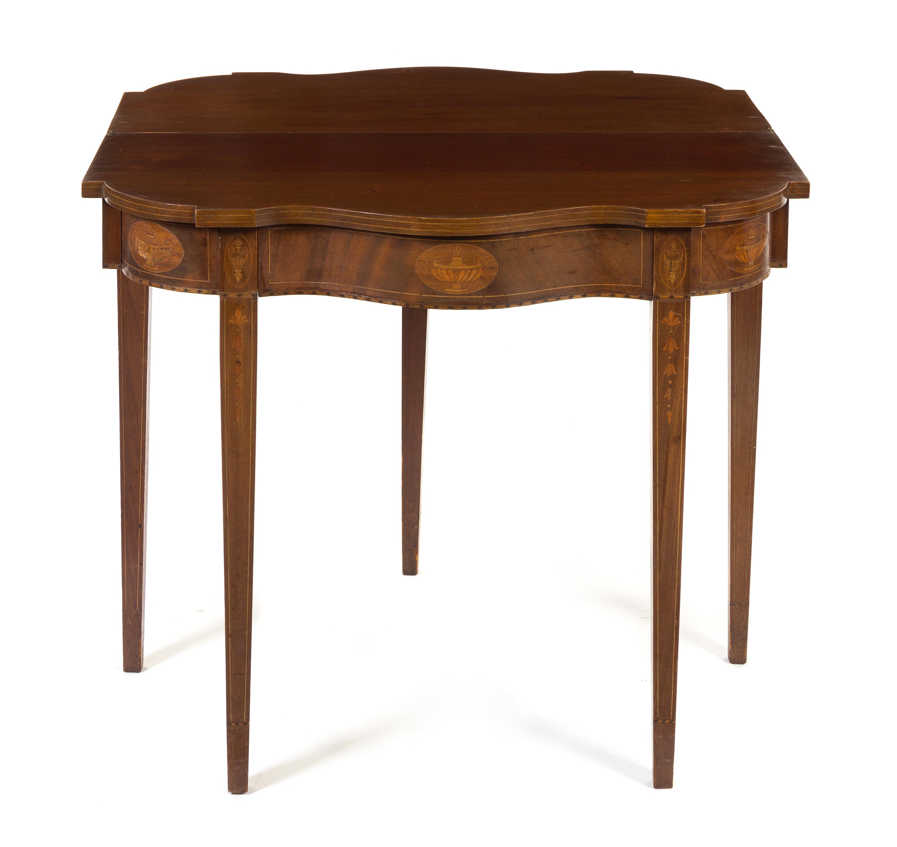 A Hepplewhite Style Marquetry Mahogany Flip-Top Games Table Height 30 x width 34 inches.