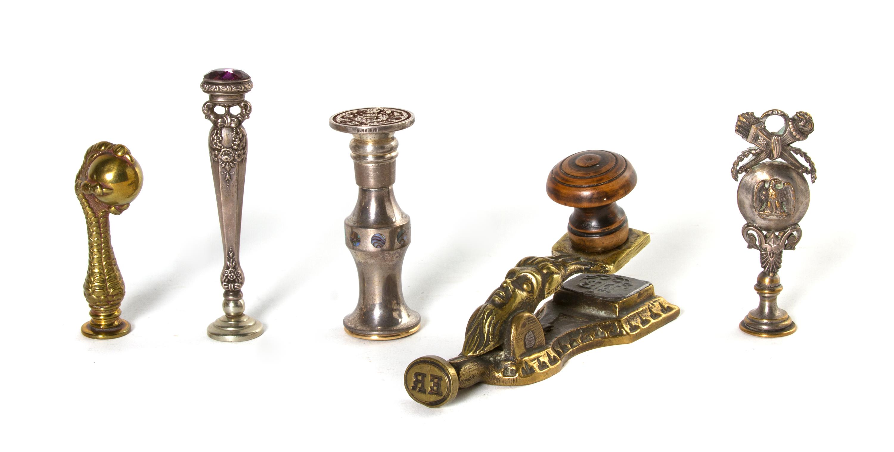 A Collection of Cast Metal and Silver Seals, Height of tallest 3 5/8 inches.