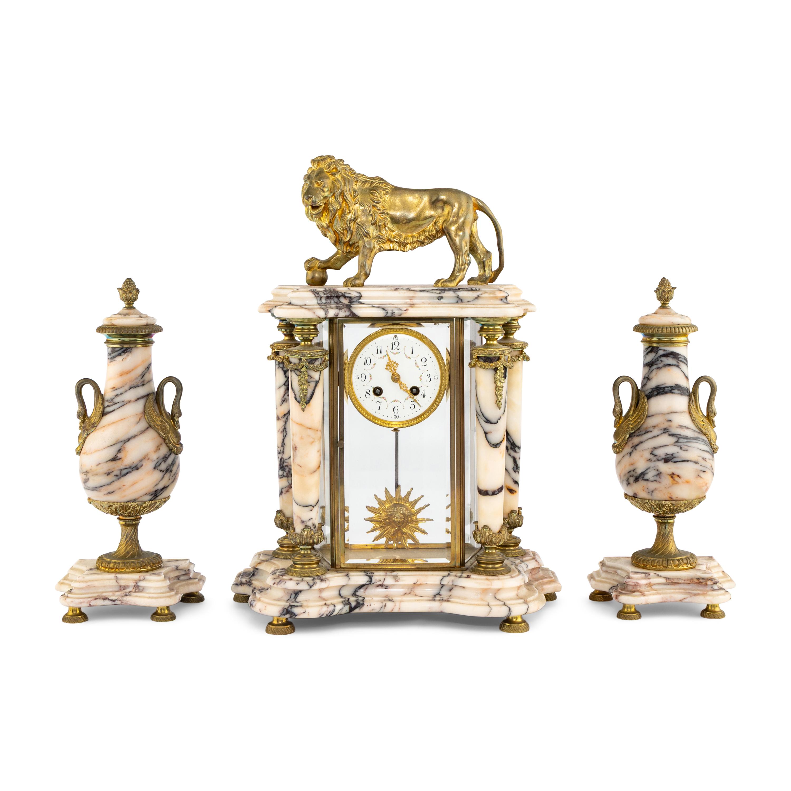 A French Gilt Bronze and Marble Clock Garniture