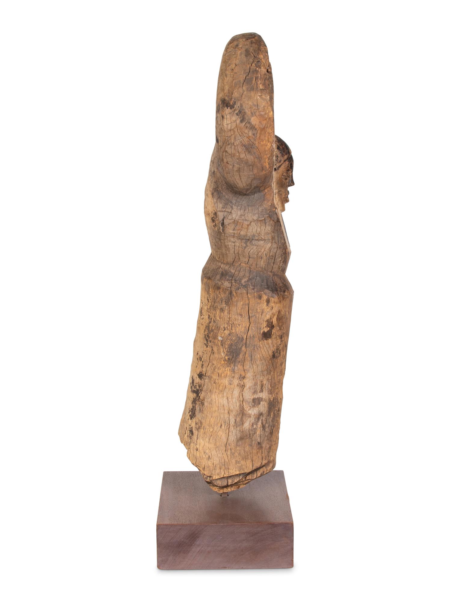 A Yaka Post, with forked finial painted blue and white, a mask in relief at the center