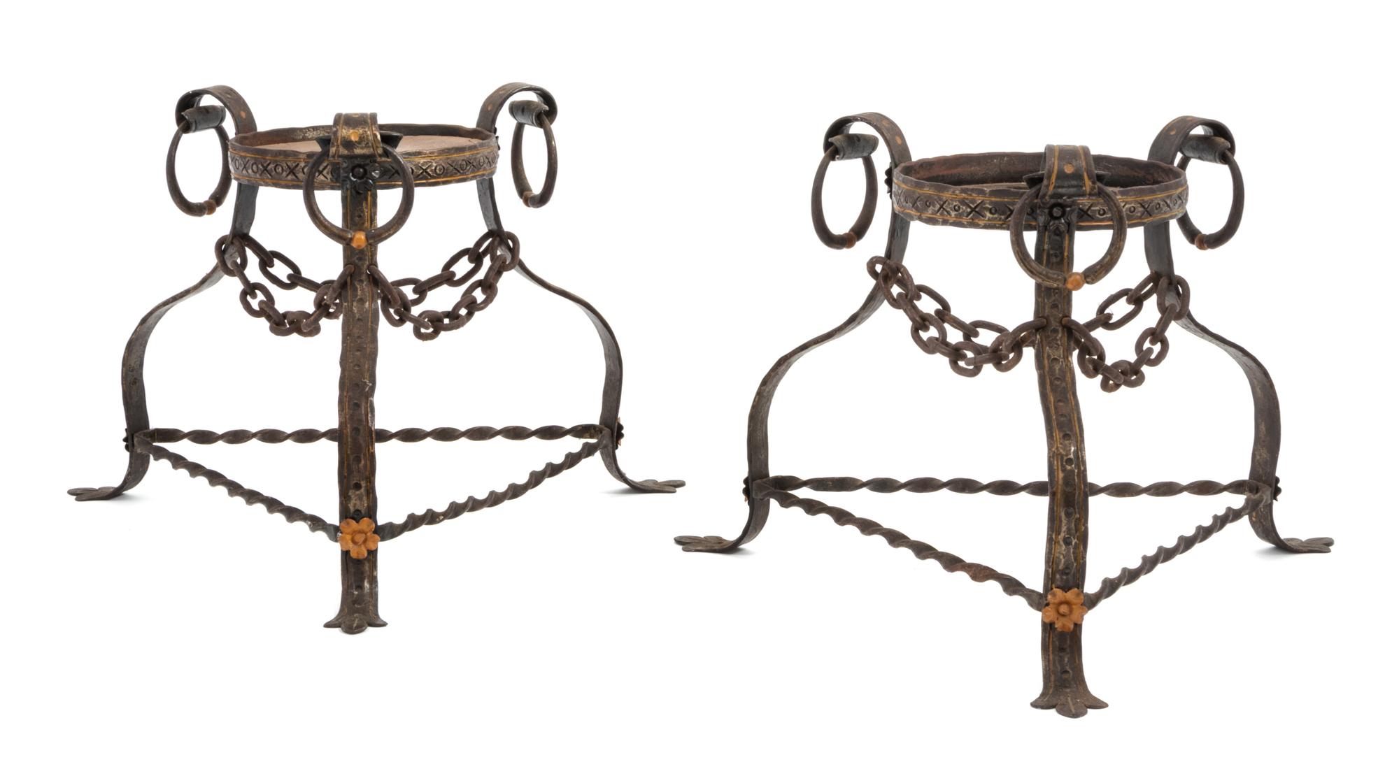 Style of Samuel Yellin (American, 1885-1940), FIRST HALF 20TH CENTURY, a pair of iron planters, each of tripod form with twisted iron s