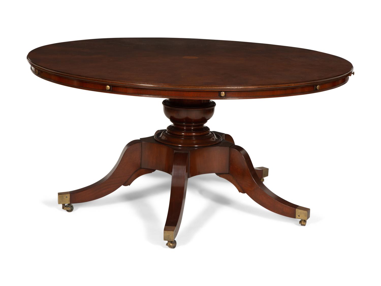 A Regency Style Mahogany Extending Circular Dining Table