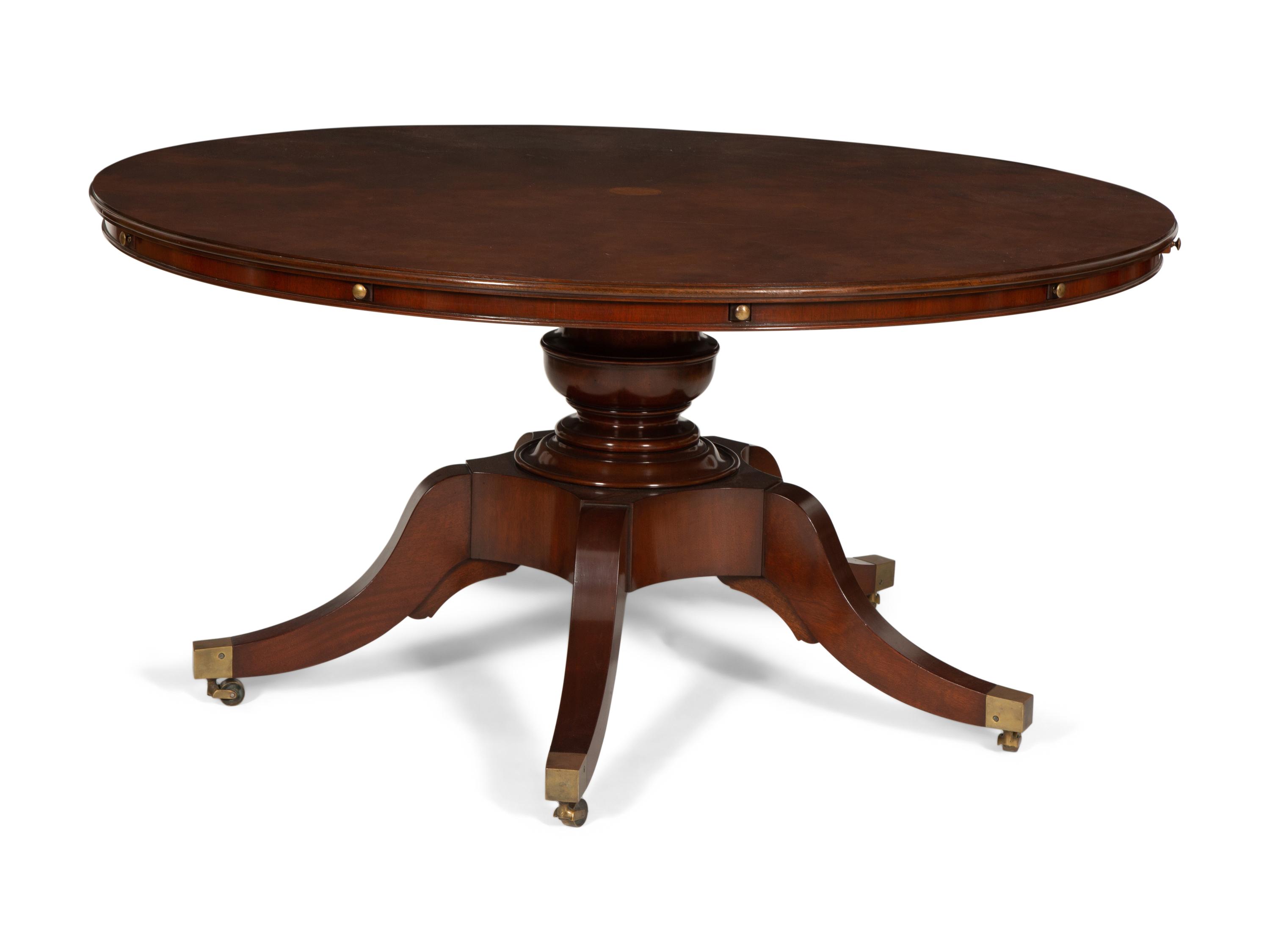 A Regency Style Mahogany Extending Circular Dining Table