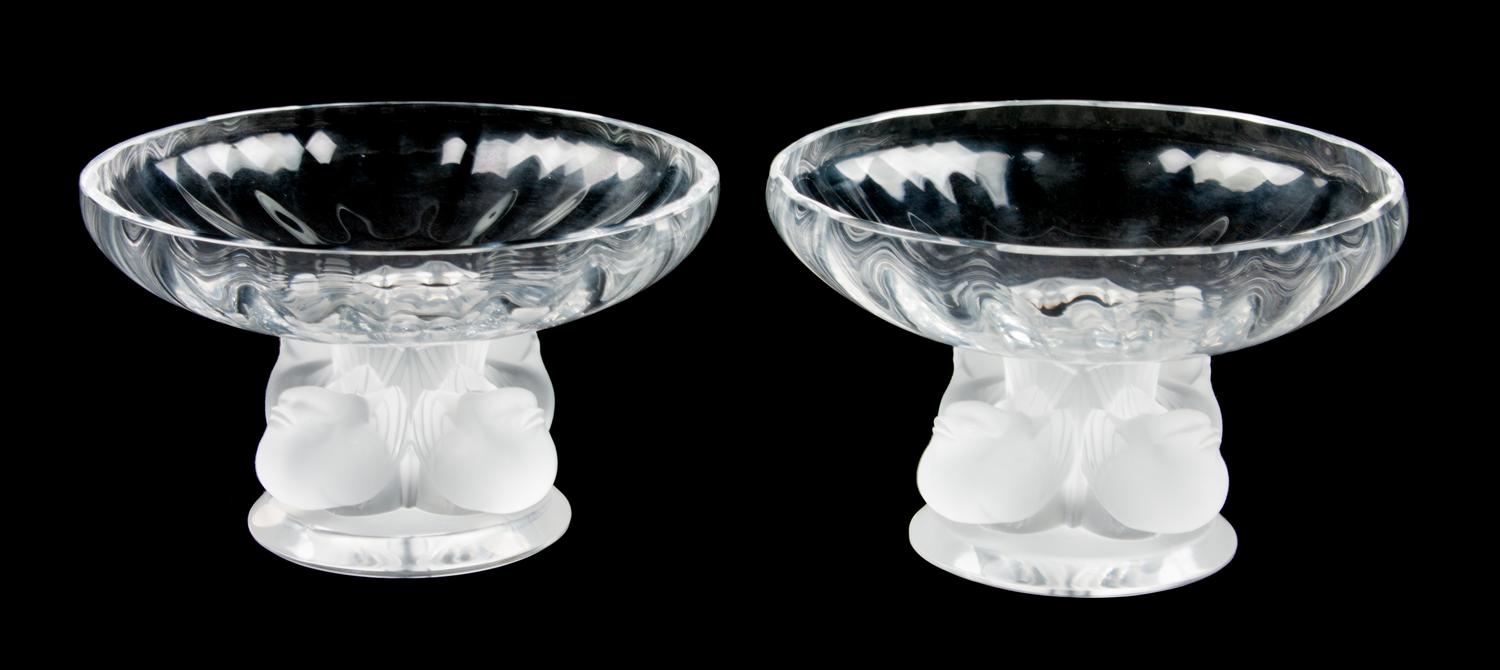 A Pair of Lalique Molded and Frosted Glass Compotes Height 3 1/2 x diameter 5 1/2 inches.