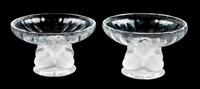 A Pair of Lalique Molded and Frosted Glass Compotes Height 3 1/2 x diameter 5 1/2 inches.