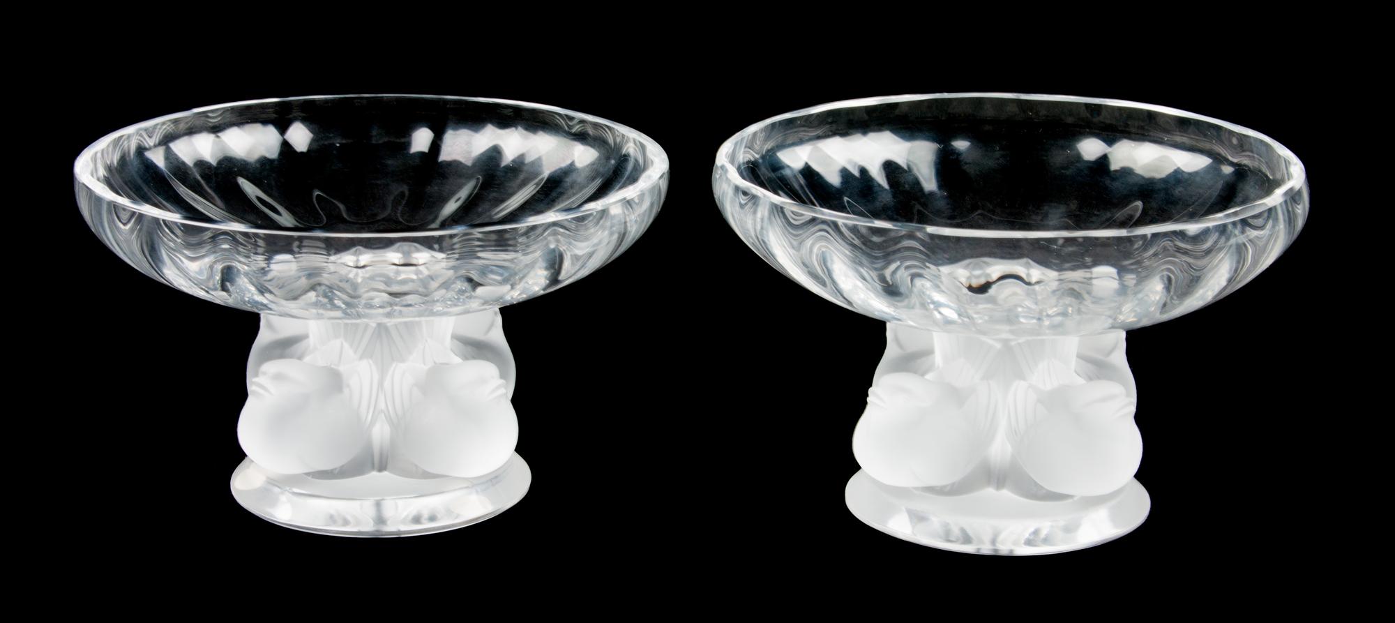 A Pair of Lalique Molded and Frosted Glass Compotes Height 3 1/2 x diameter 5 1/2 inches.