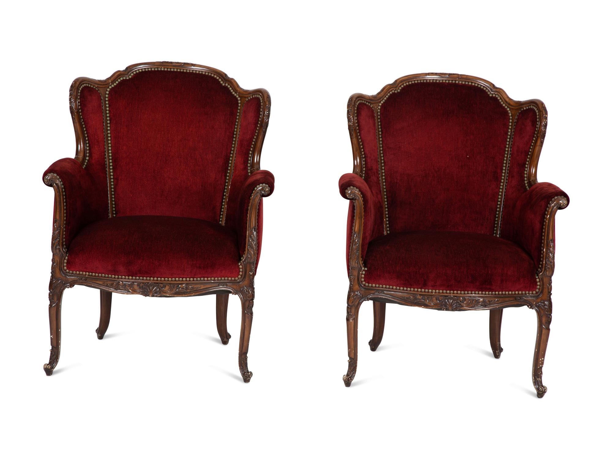 A Pair of Louis XV Style Walnut Bergères