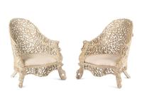 A Pair of Indian Painted Teakwood Armchairs and a Similar Table