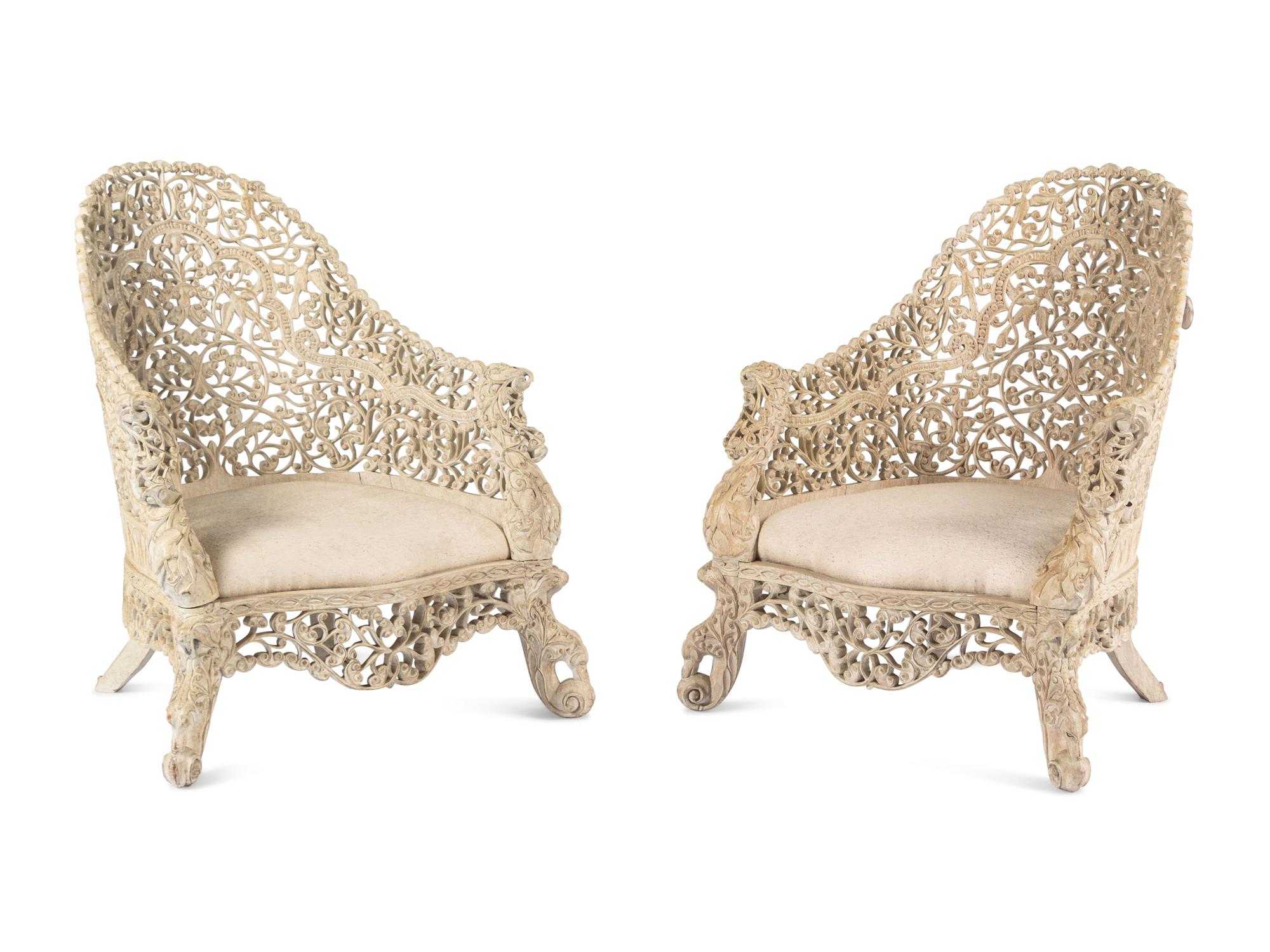 A Pair of Indian Painted Teakwood Armchairs and a Similar Table