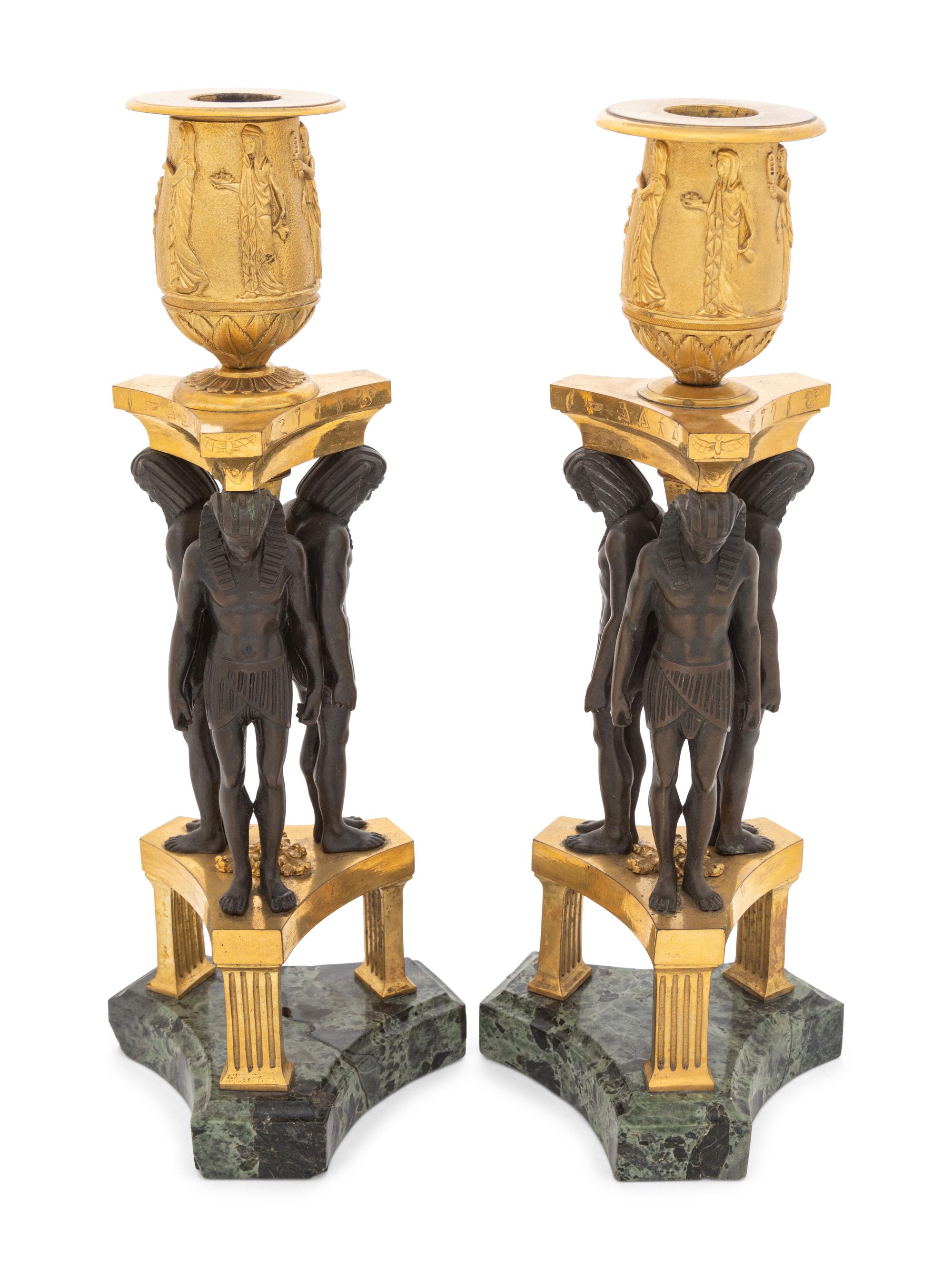 A Pair of French Egyptian Revival Bronze and Marble Candlesticks