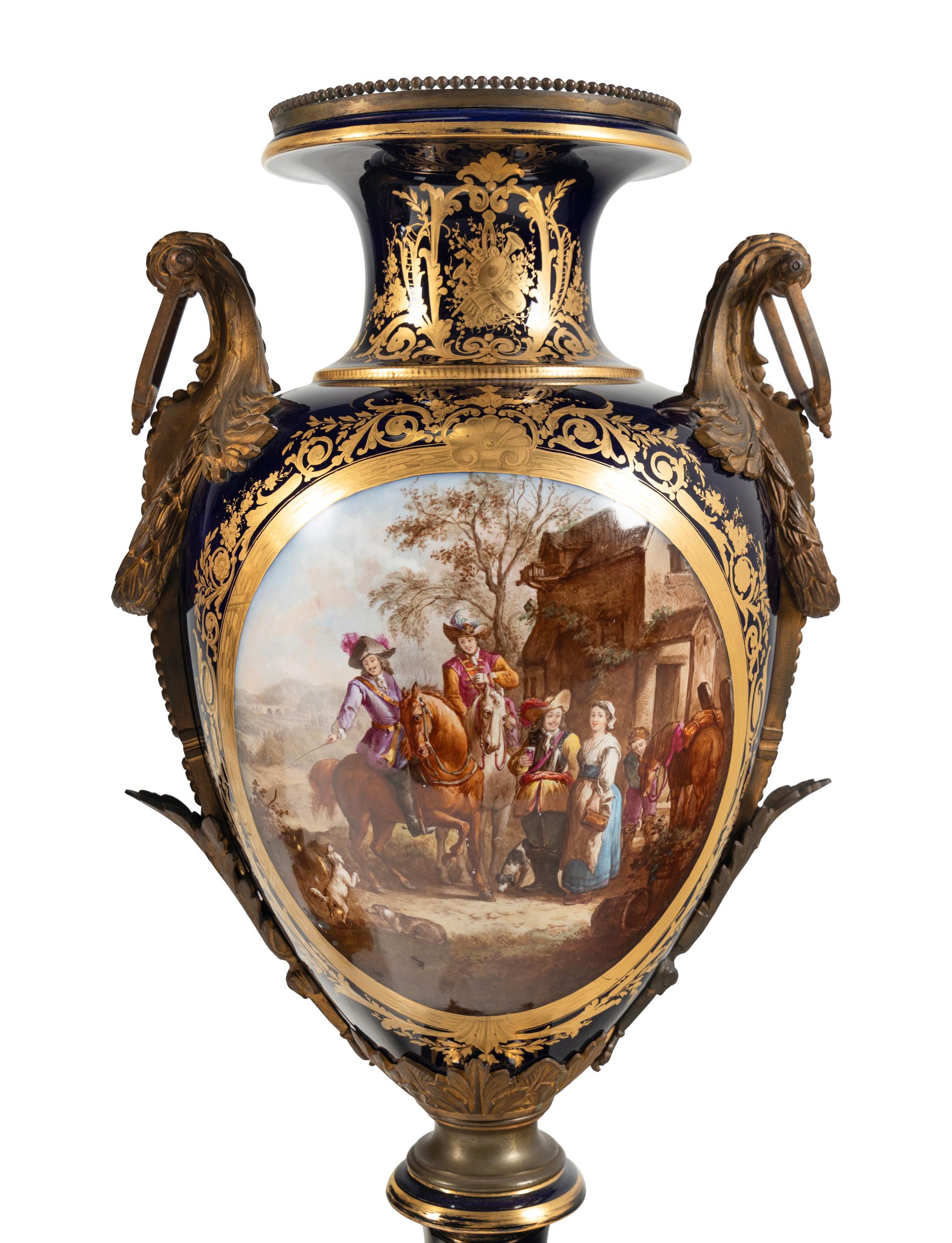 A Pair of Large Gilt Bronze Mounted Sèvres Style Porcelain Urns