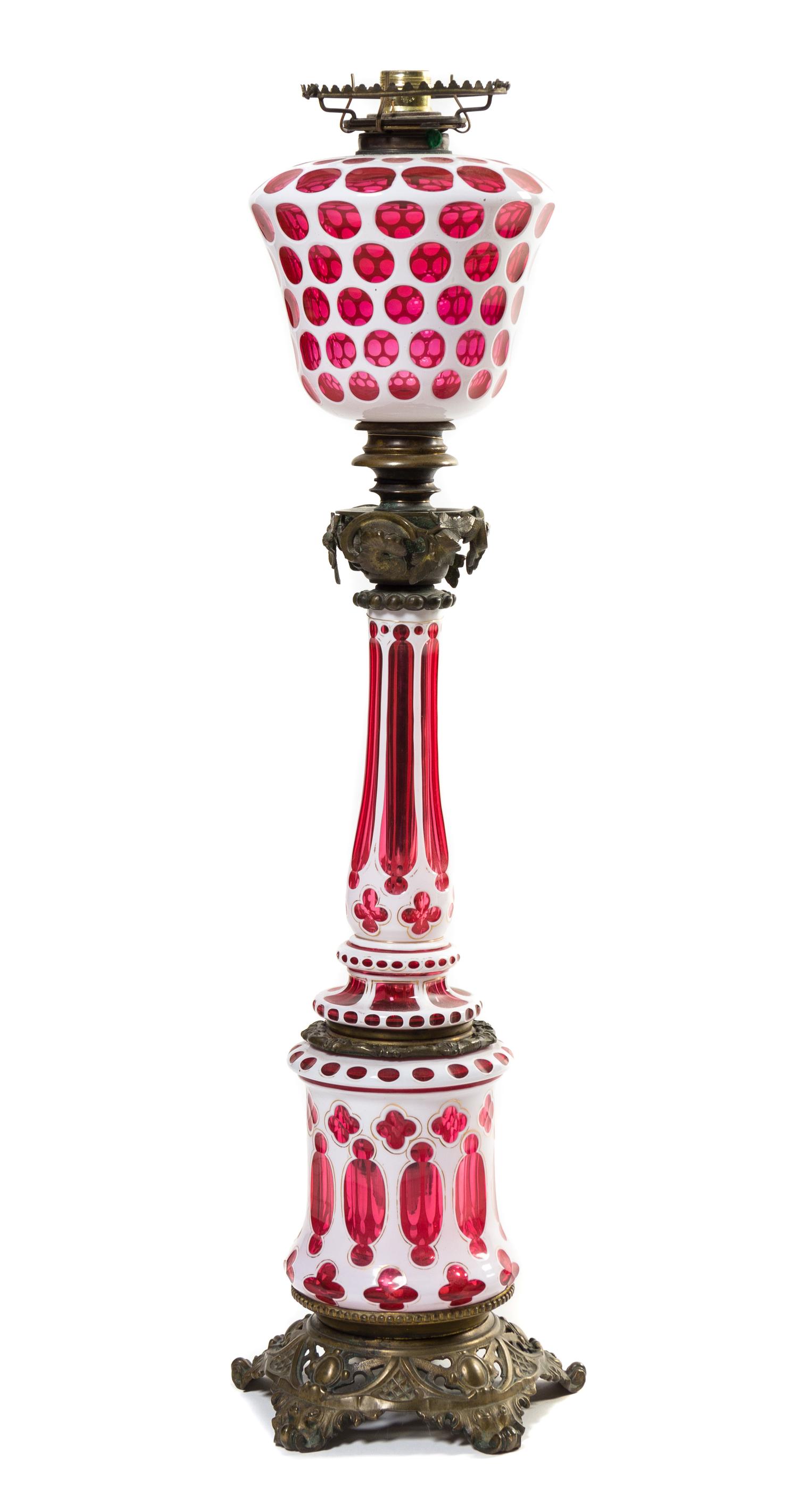 An American Double Overlay Glass Fluid Lamp Height 35 inches.