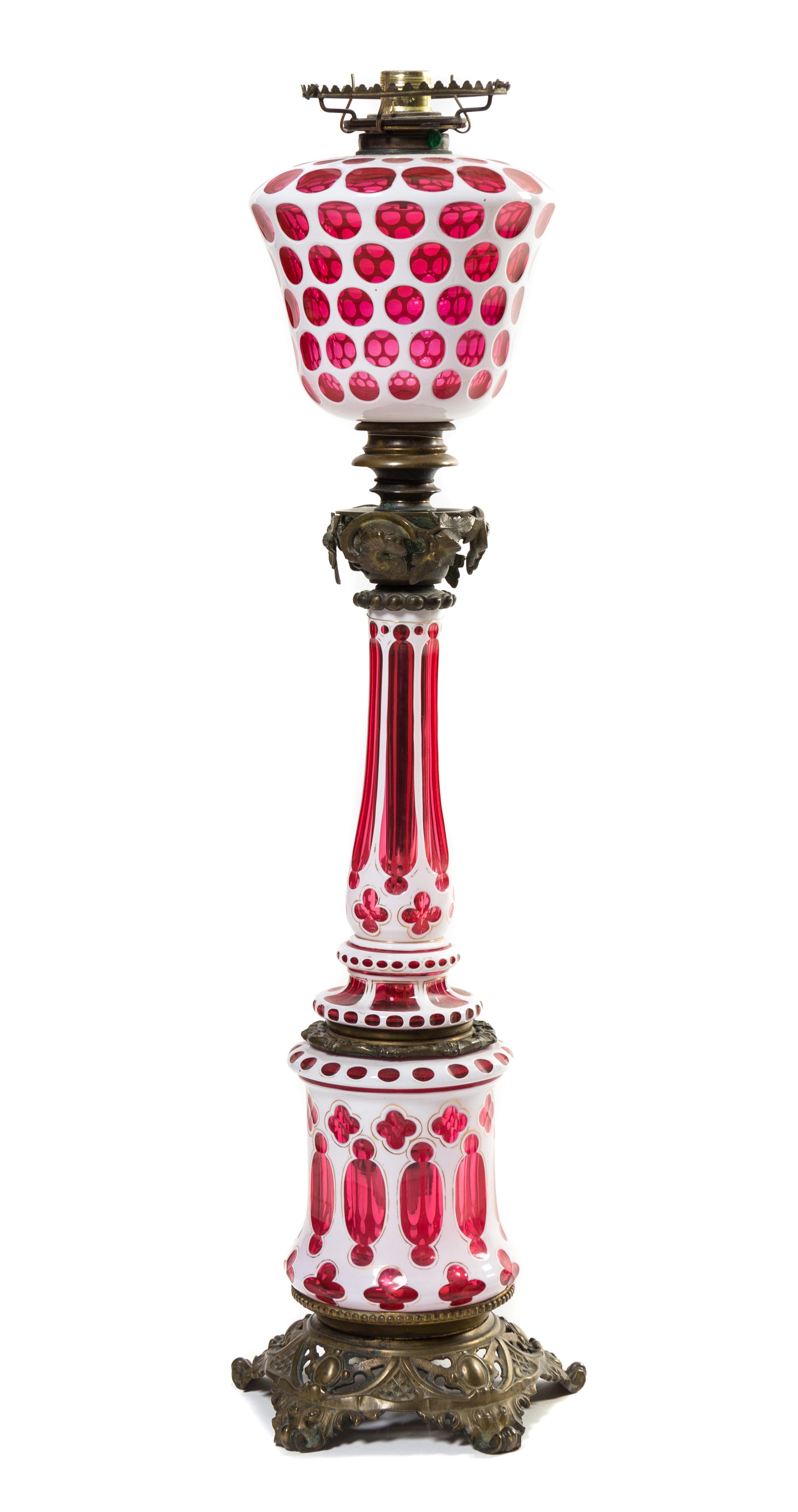 An American Double Overlay Glass Fluid Lamp Height 35 inches.