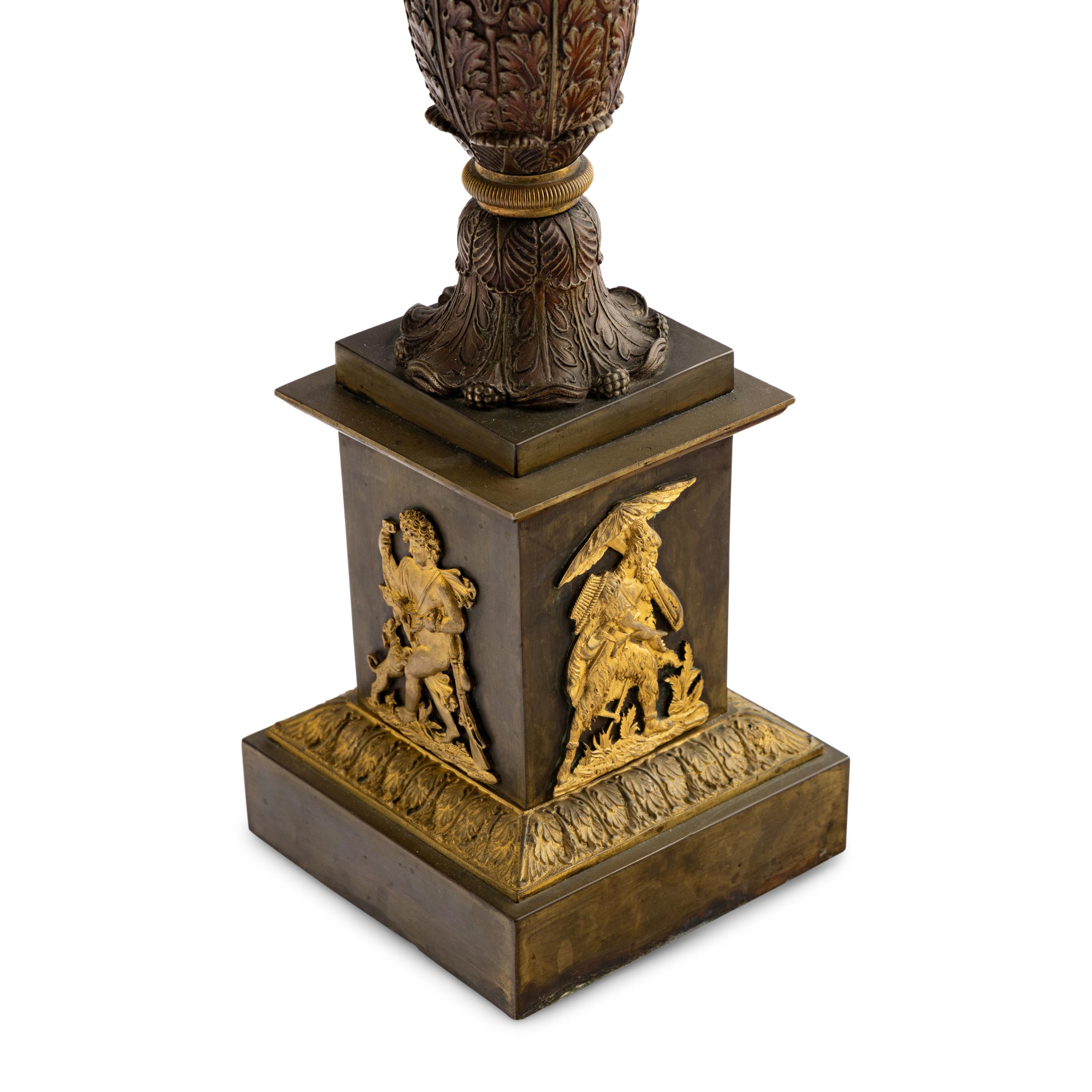 A Pair of French Parcel Gilt Bronze Columnar Lamps