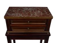 A Directoire Style Mahogany Marble-Top Chest on a Stand