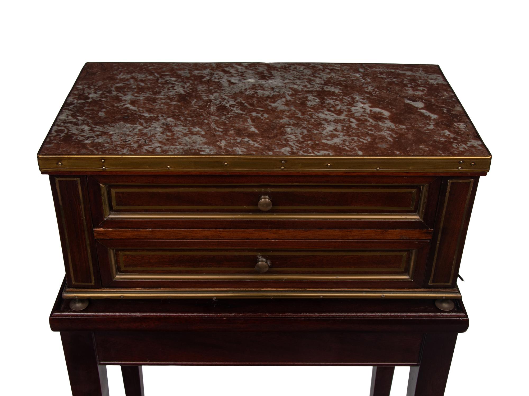 A Directoire Style Mahogany Marble-Top Chest on a Stand
