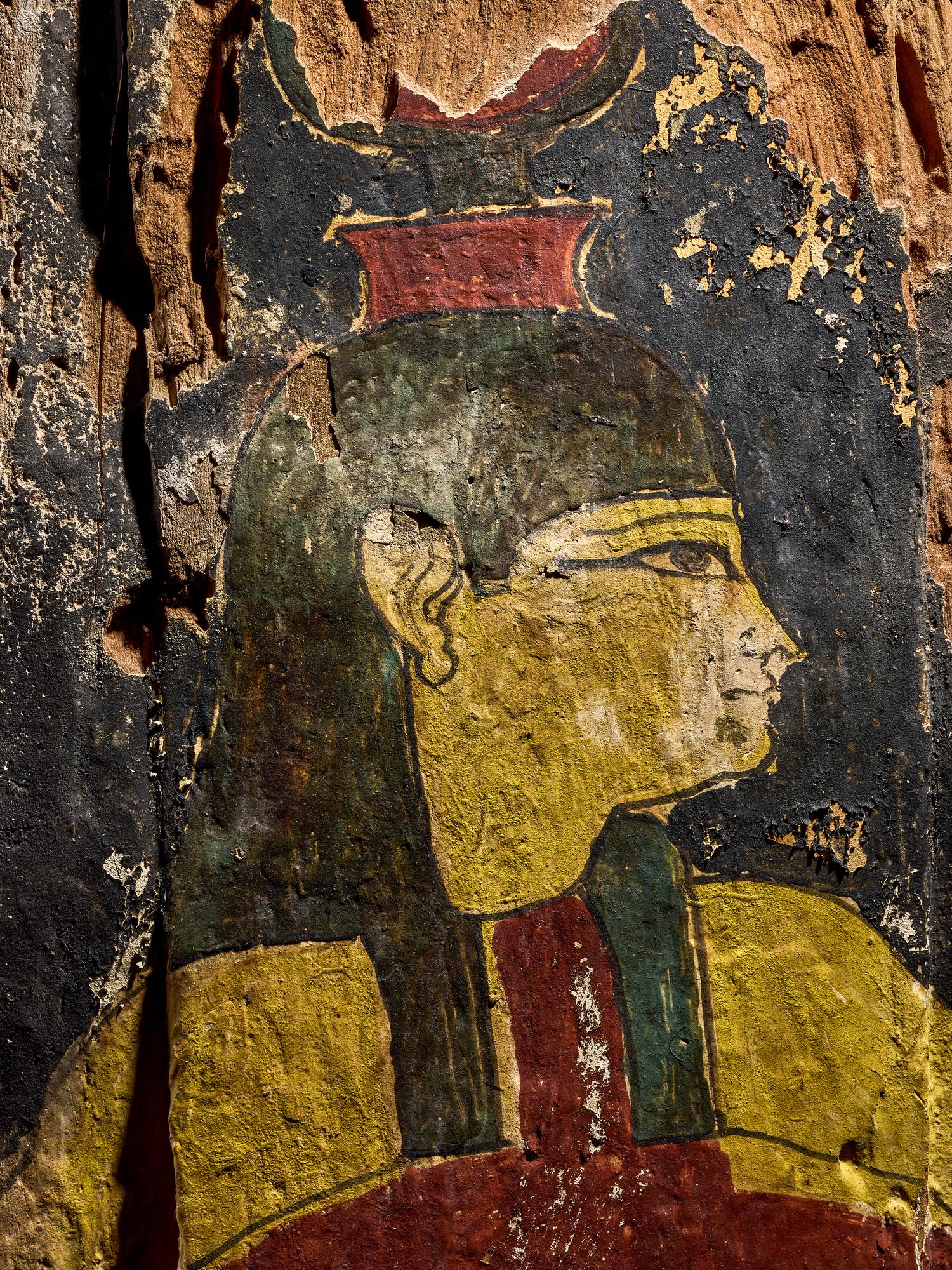 An Egyptian Painted Wood Sarcophagus Fragment with Isis