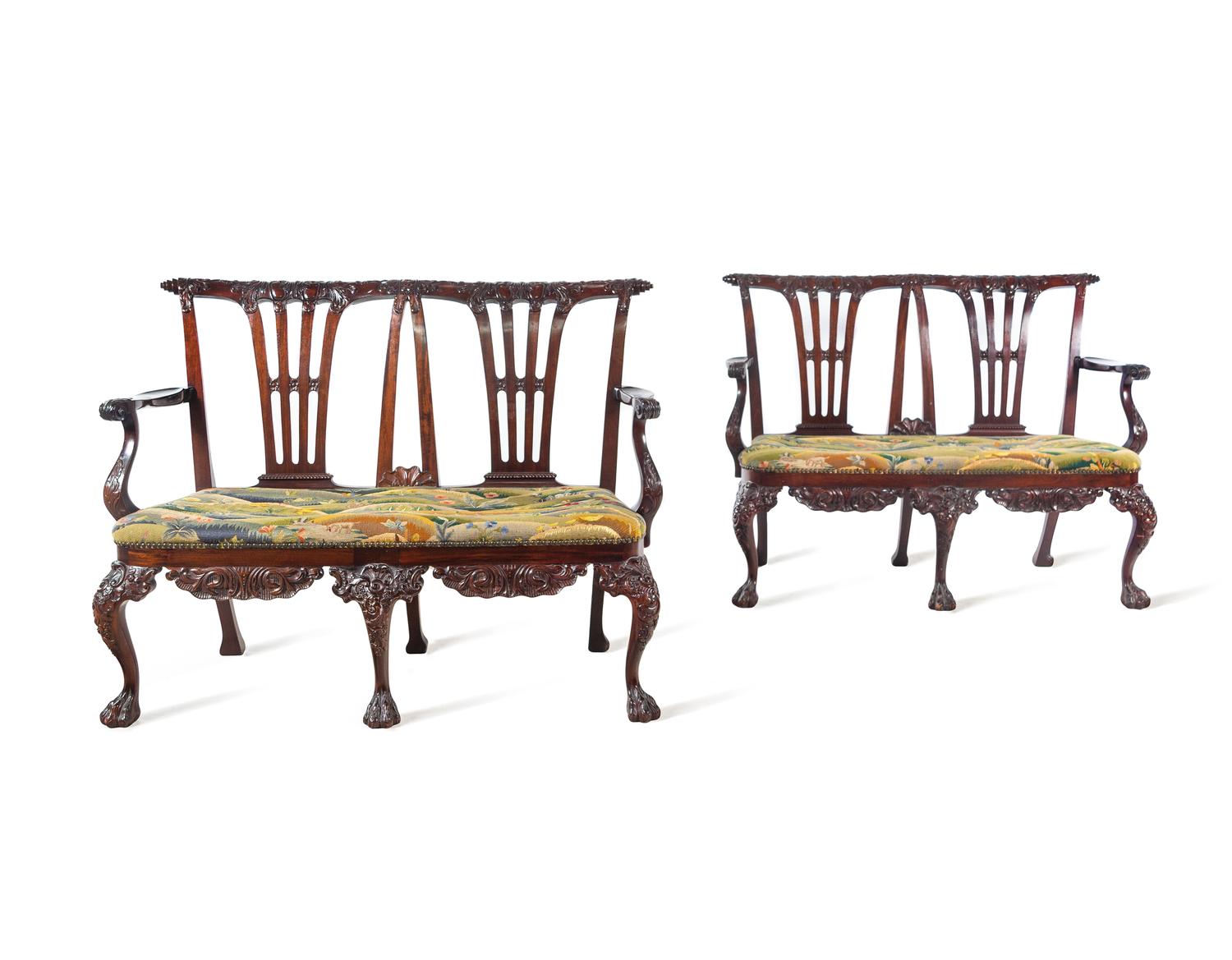 A Pair of Irish George II Style Carved Mahogany Double-Back Settees