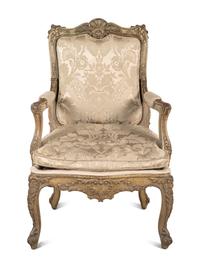 A Louis XV Style Carved and Gray-Painted Fauteuil