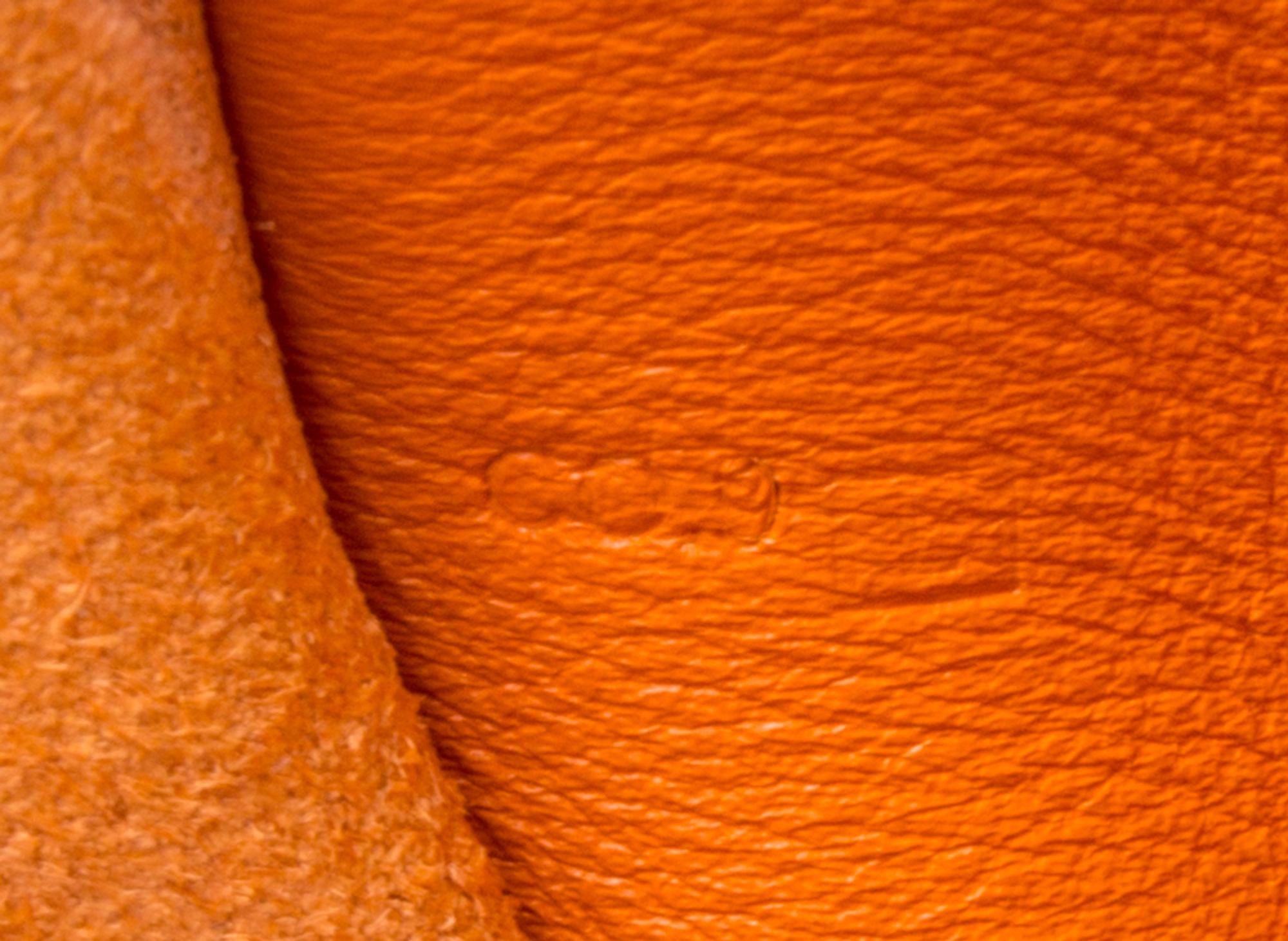 An Hermes Orange Leather Passport Pouch, 7" x 8" x 1".
