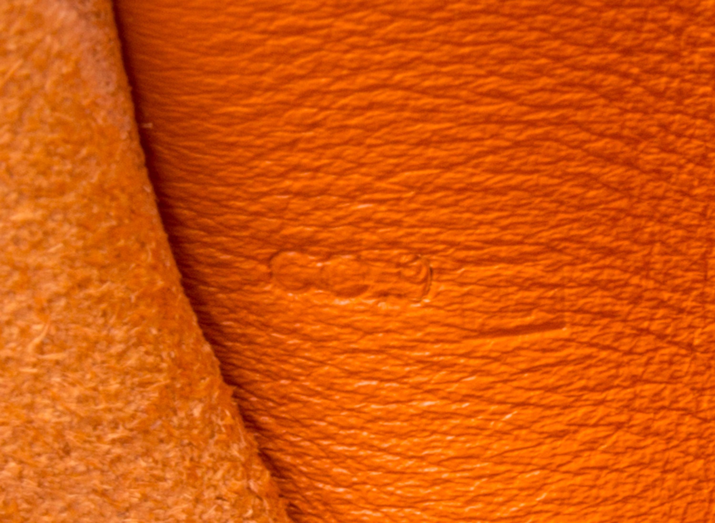An Hermes Orange Leather Passport Pouch, 7" x 8" x 1".