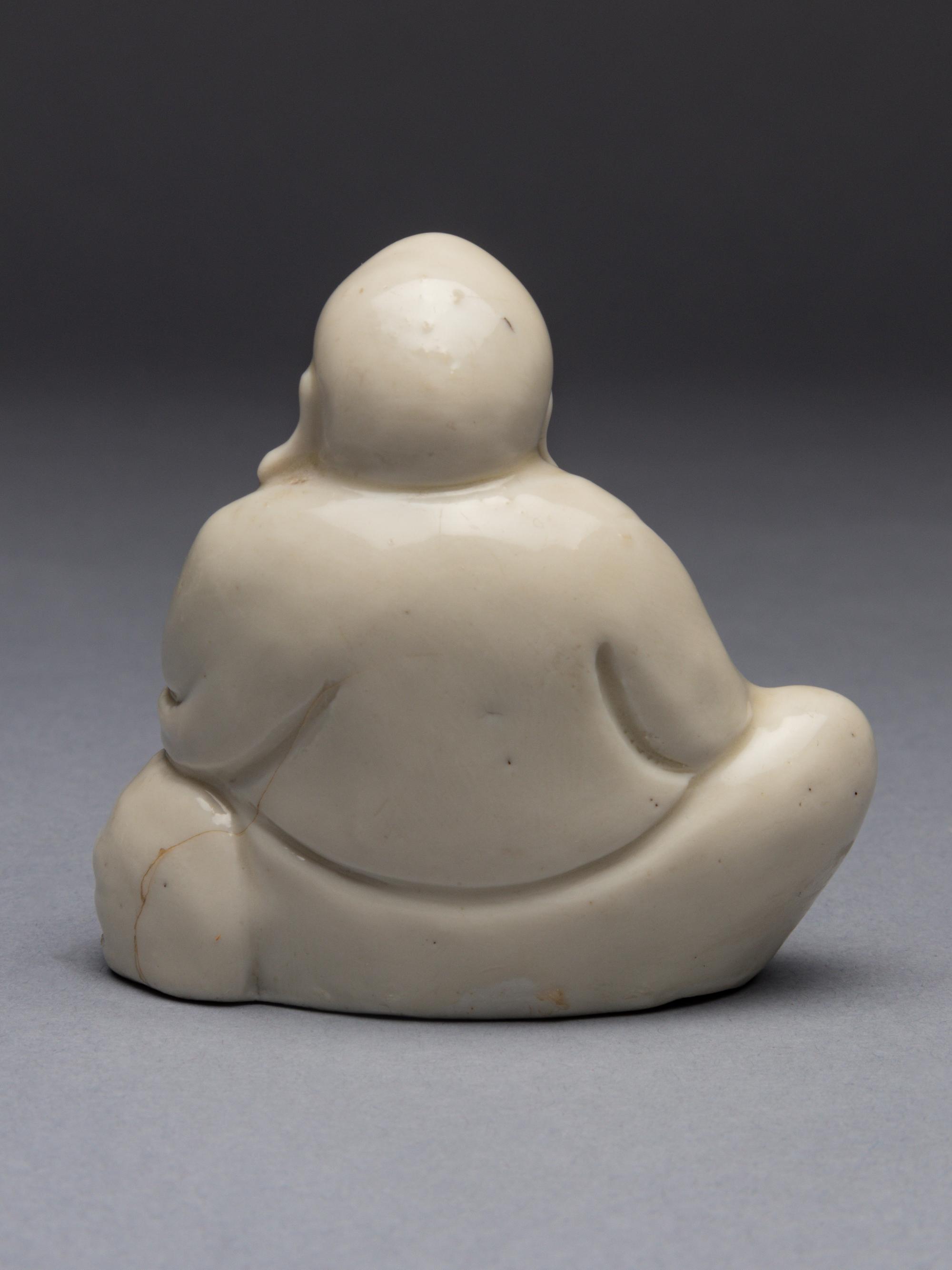 A Blanc-de-Chine Porcelain Figure of Budai Buddha
