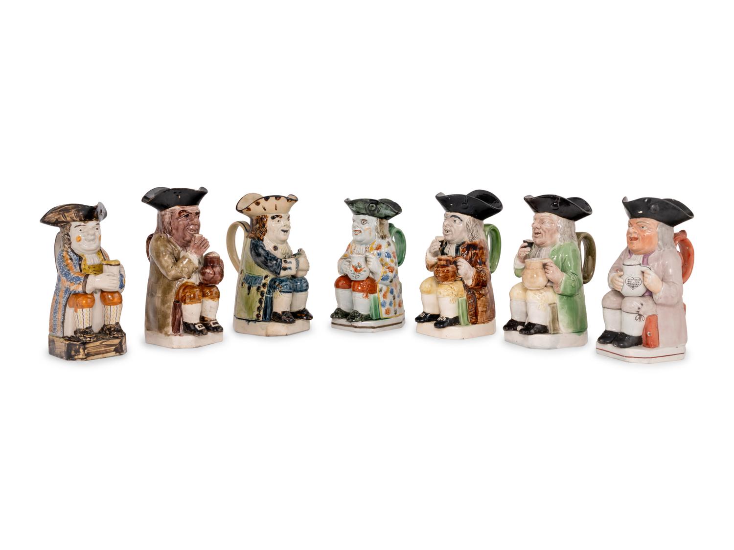 A Collection of Seven Ceramic Toby Mugs