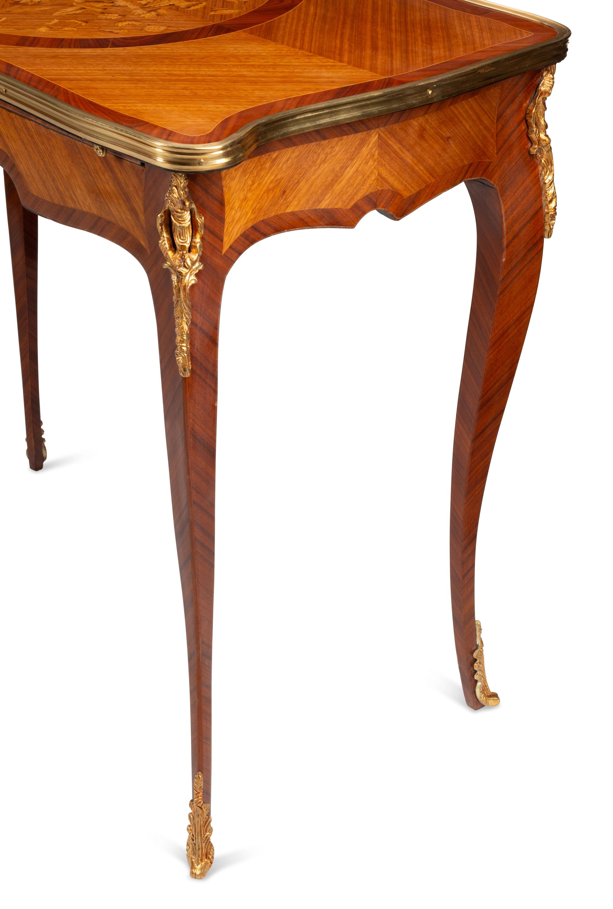 A Pair of Louis XV Style Gilt Bronze Mounted Marquetry Tables