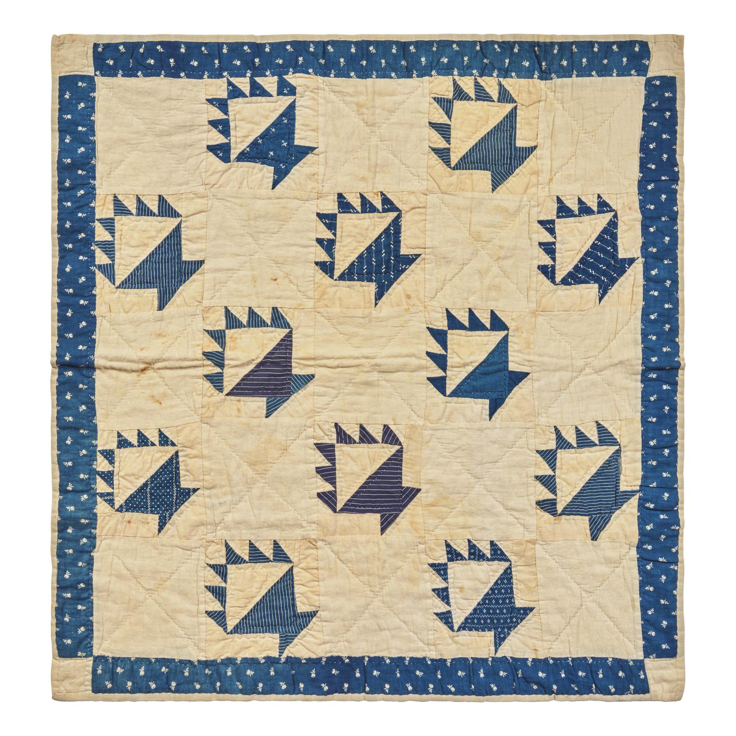 A Pieced Cotton Blue and White "Berry Baskets" Crib Quilt