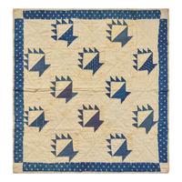 A Pieced Cotton Blue and White "Berry Baskets" Crib Quilt
