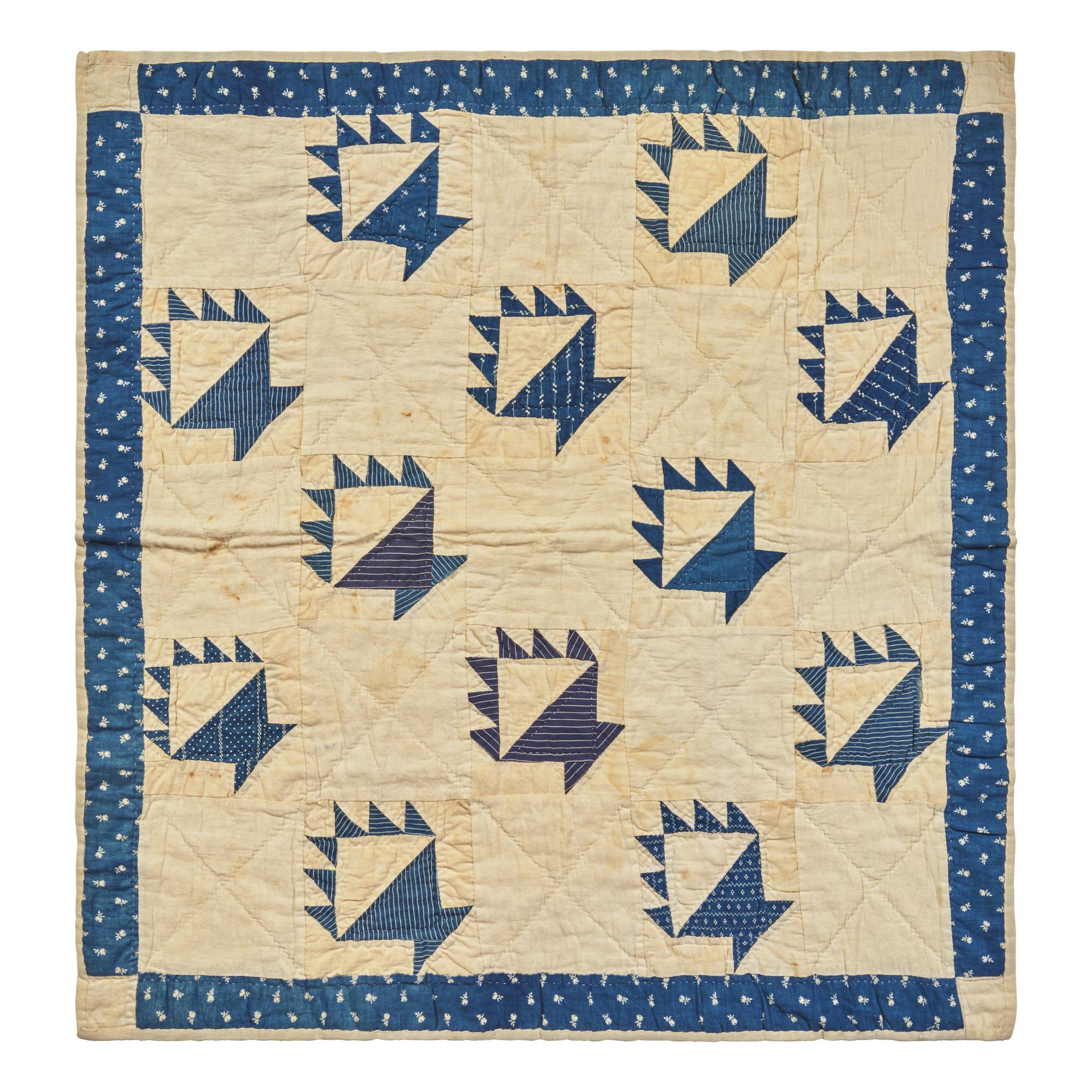 A Pieced Cotton Blue and White "Berry Baskets" Crib Quilt