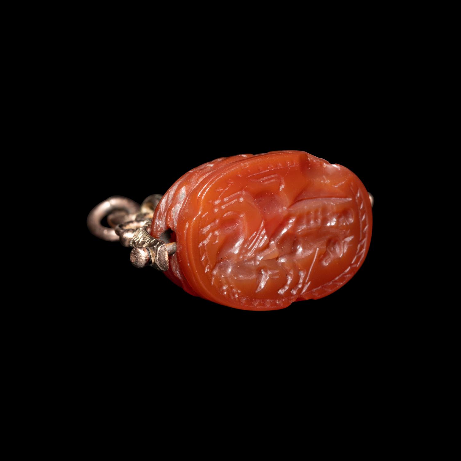 An Etruscan Carnelian Scarab with Warrior on Horseback and a Griffin — Set in a 19th Century gold swivel fob
