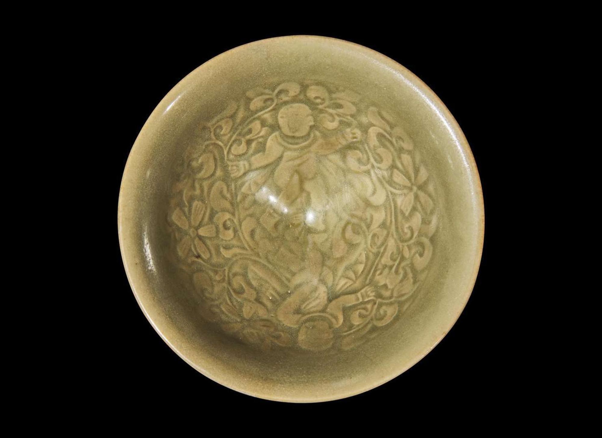 A Chinese Yaozhou celadon-glazed "Boys" bowl, Northern Song dynasty 耀州窯嬰戲盌 北宋