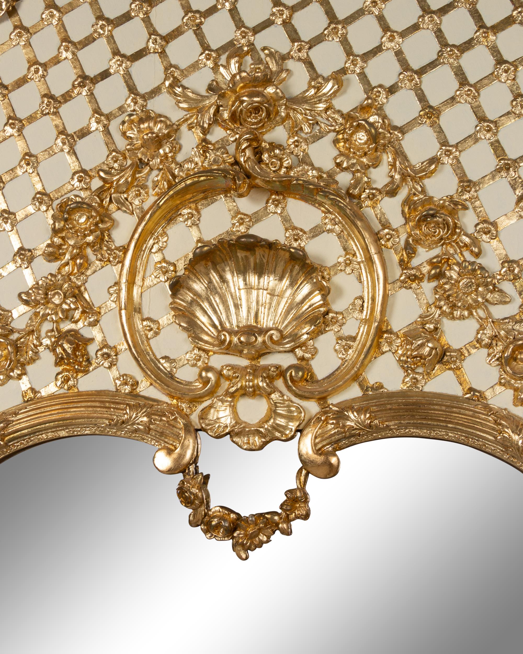 A Pair of French Painted and Parcel Gilt Trumeau Mirrors