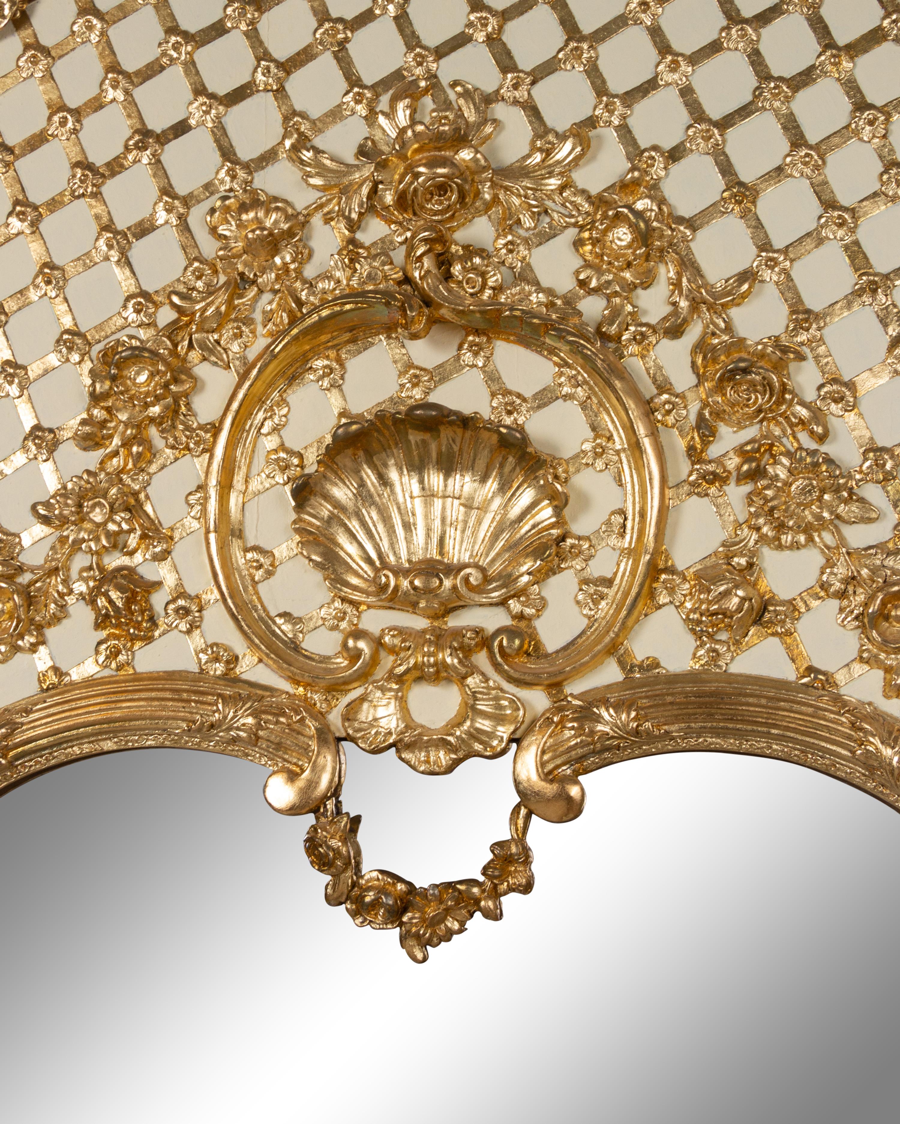 A Pair of French Painted and Parcel Gilt Trumeau Mirrors